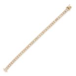 A DIAMOND LINE BRACELET in 18ct yellow gold, comprising a single row of links set with baguette