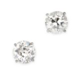 A PAIR OF SOLITAIRE DIAMOND STUD EARRINGS each set with an old European cut diamond of 3.55 and 2.96