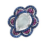A MOONSTONE, RUBY, SAPPHIRE AND DIAMOND RING set with a pear shaped moonstone cabochon bordered by