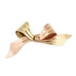 CARTIER, A VINTAGE TWO COLOUR GOLD BOW BROOCH designed as a bicoloured ribbon tied in a bow,