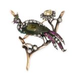 A GEM SET PEACOCK BROOCH / PENDANT designed to depict a peacock perched atop a branch, its body