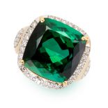 A GREEN TOURMALINE AND DIAMOND RING in yellow gold, set with a cushion shaped green tourmaline