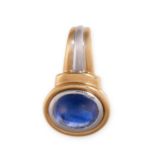 A SAPPHIRE PENDANT of bicoloured design, set with an oval cabochon blue sapphire weighing 2.76
