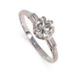 A DIAMOND SOLITAIRE ENGAGEMENT RING set with a round cut diamond of 1.00 carats between baguette cut