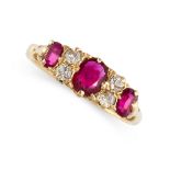 A RUBY AND DIAMOND DRESS RING set with a trio of graduated cushion cut rubies, accented by pairs