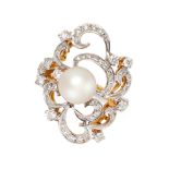 A PEARL AND DIAMOND DRESS RING of scrolling design, set with a central pearl measuring approximately