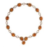 A VINTAGE CITRINE NECKLACE, CIRCA 1960 in yellow gold, comprising a series of ten links set with