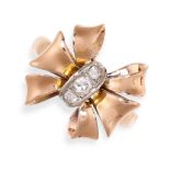 A VINTAGE DIAMOND BOW RING in yellow gold, of ribbon bow design, set with a trio of graduated round,