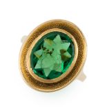 AN INTAGLIO SEAL / SIGNET RING set with an oval faceted green paste gemstone, the table facet