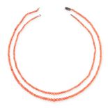 A TWO ROW CORAL BEAD NECKLACE the beads measuring approximately 2.8-7.0mm diameters, requires