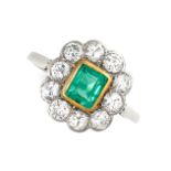 AN EMERALD AND DIAMOND DRESS RING in 14ct white and yellow gold, set with a step cut emerald