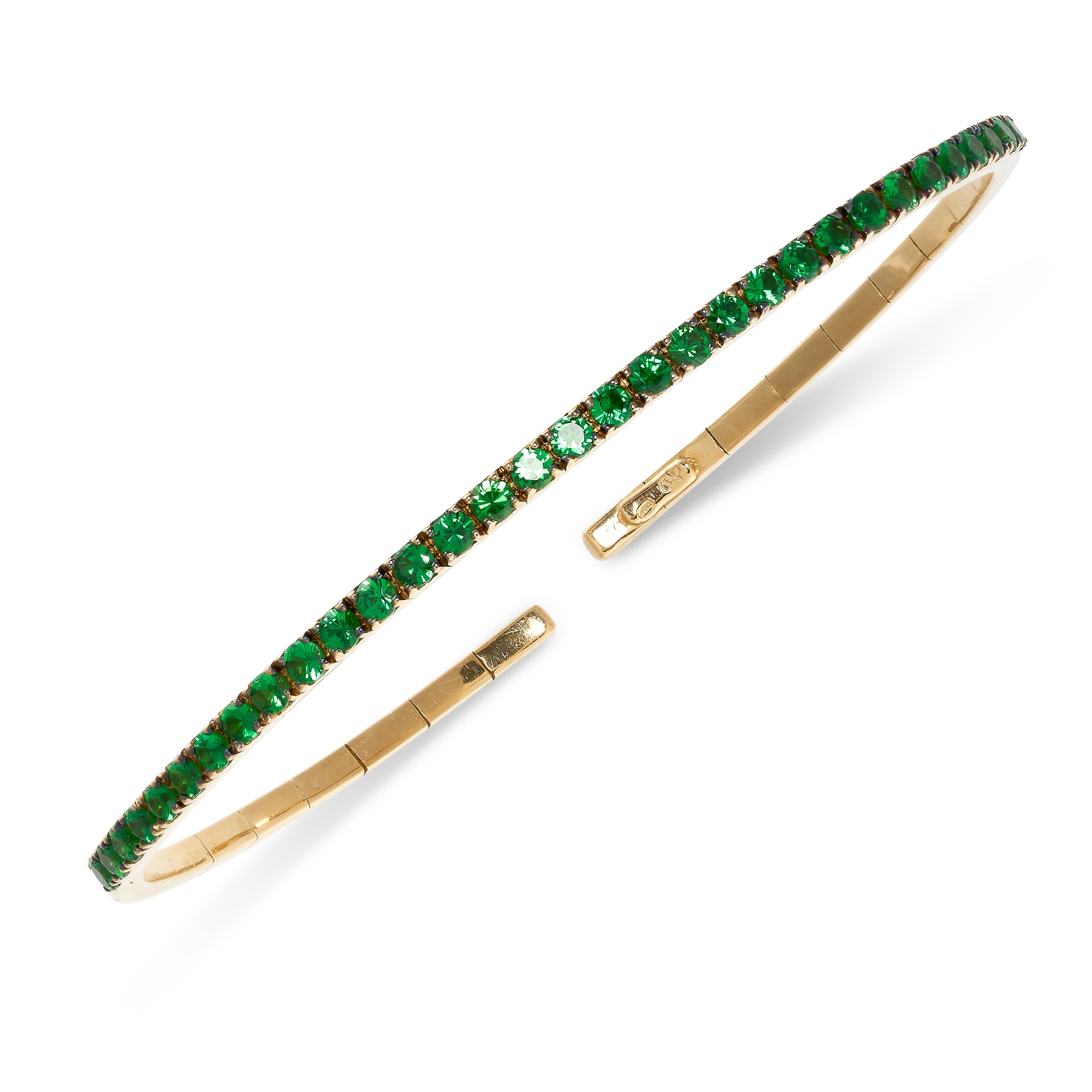 A TSAVORITE GARNET BANGLE the flexible bangle set to the front with a line of round cut tsavorite