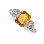 A YELLOW SAPPHIRE AND DIAMOND RING set with an emerald cut yellow sapphire weighing 1.74 carats,