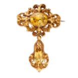 AN ANTIQUE CITRINE BROOCH, MID 19TH CENTURY set with an oval citrine, within a stamped foliate
