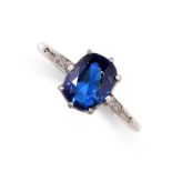 A SAPPHIRE AND DIAMOND RING in platinum, set with a cushion shaped blue sapphire of 2.14 carats,