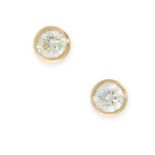 A PAIR OF SOLITAIRE DIAMOND STUD EARRINGS each set with a round cut diamond in a bezel setting,