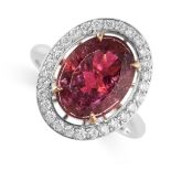 A PINK TOURMALINE AND DIAMOND RING set with an oval cut pink tourmaline weighing 3.93 carats