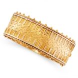 AN ANTIQUE CUFF BANGLE, 19TH CENTURY in yellow gold, in the Etruscan revival manner, the hinged body