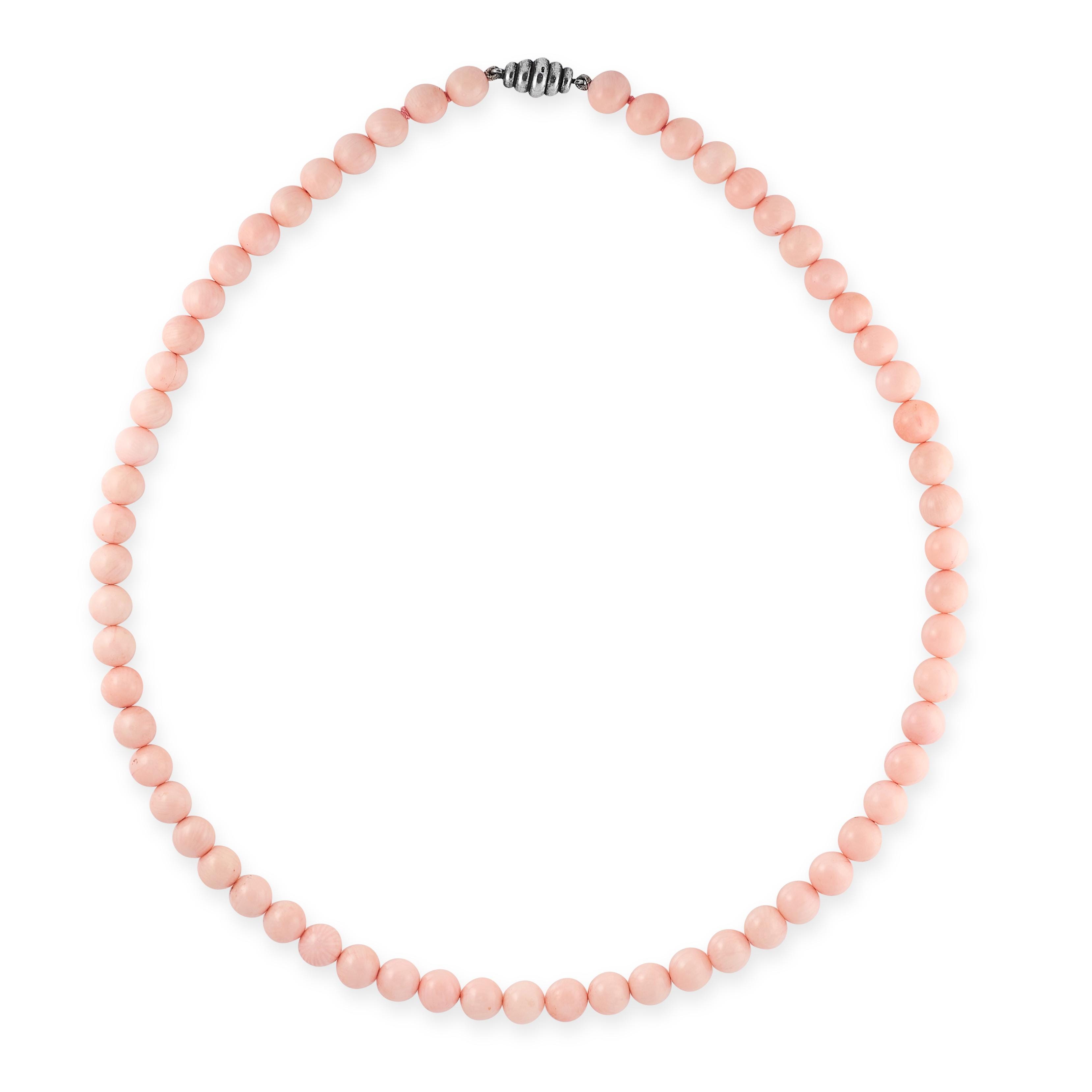 A CORAL BEAD NECKLACE comprising a single row of sixty two angel skin pink coral beads measuring