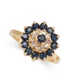 A SAPPHIRE AND DIAMOND DRESS RING set with a round cut sapphire in a concentric border of round