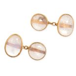 A PAIR OF ANTIQUE MOONSTONE CUFFLINKS in yellow gold, each set with an oval and round cabochon