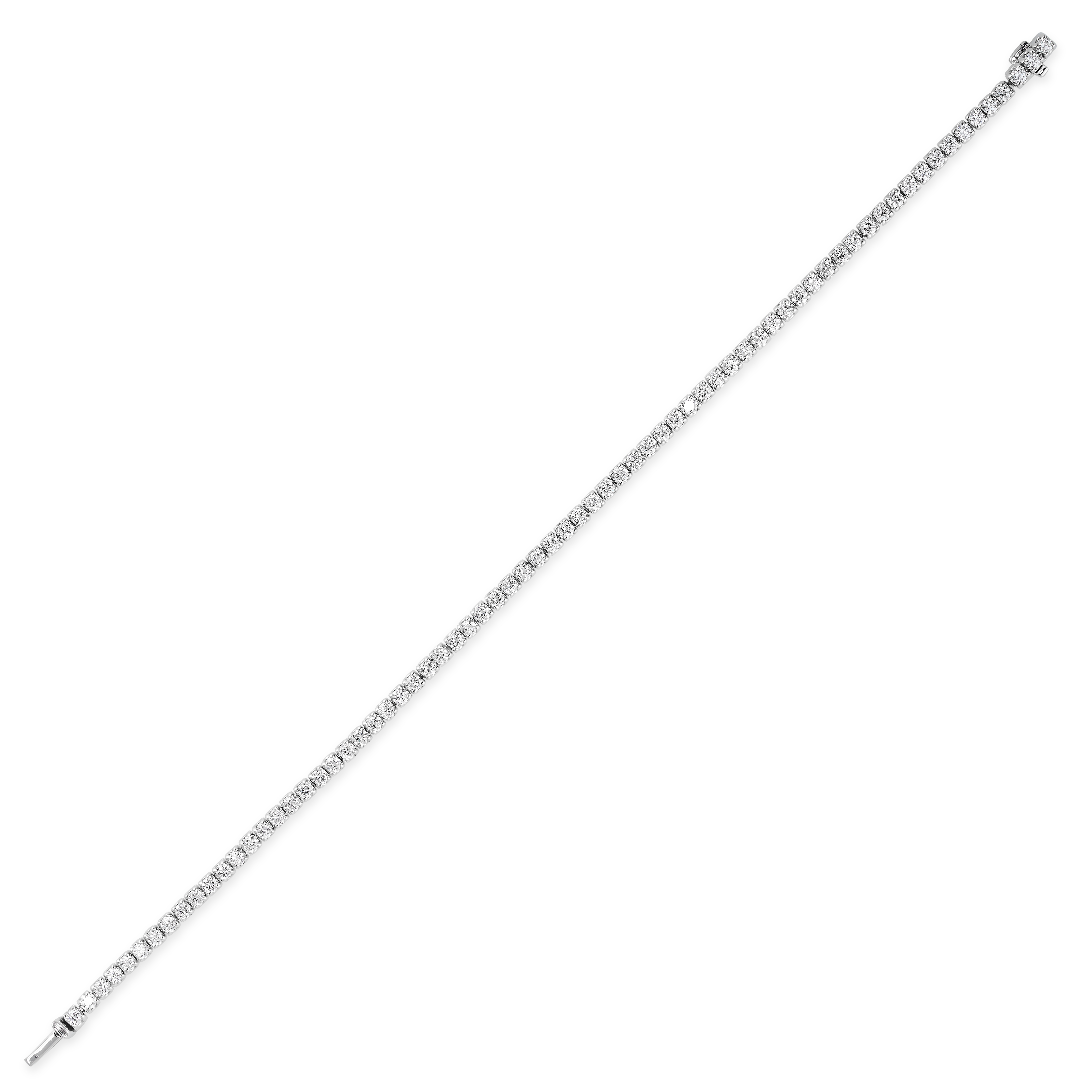 A DIAMOND LINE BRACELET in 18ct white gold, comprising a single row of seventy two round cut