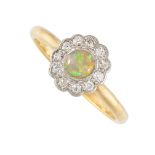NO RESERVE - AN OPAL AND DIAMOND CLUSTER RING in 18ct yellow gold and platinum, set with an oval