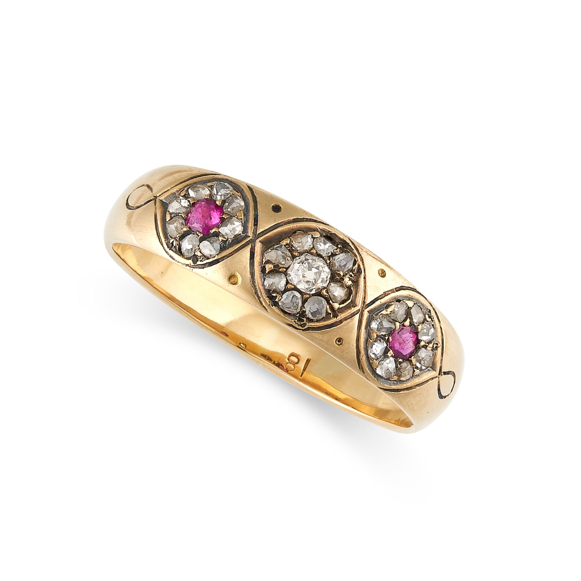 NO RESERVE - A RUBY AND DIAMOND DRESS RING in 18ct yellow gold, the tapering band set with three