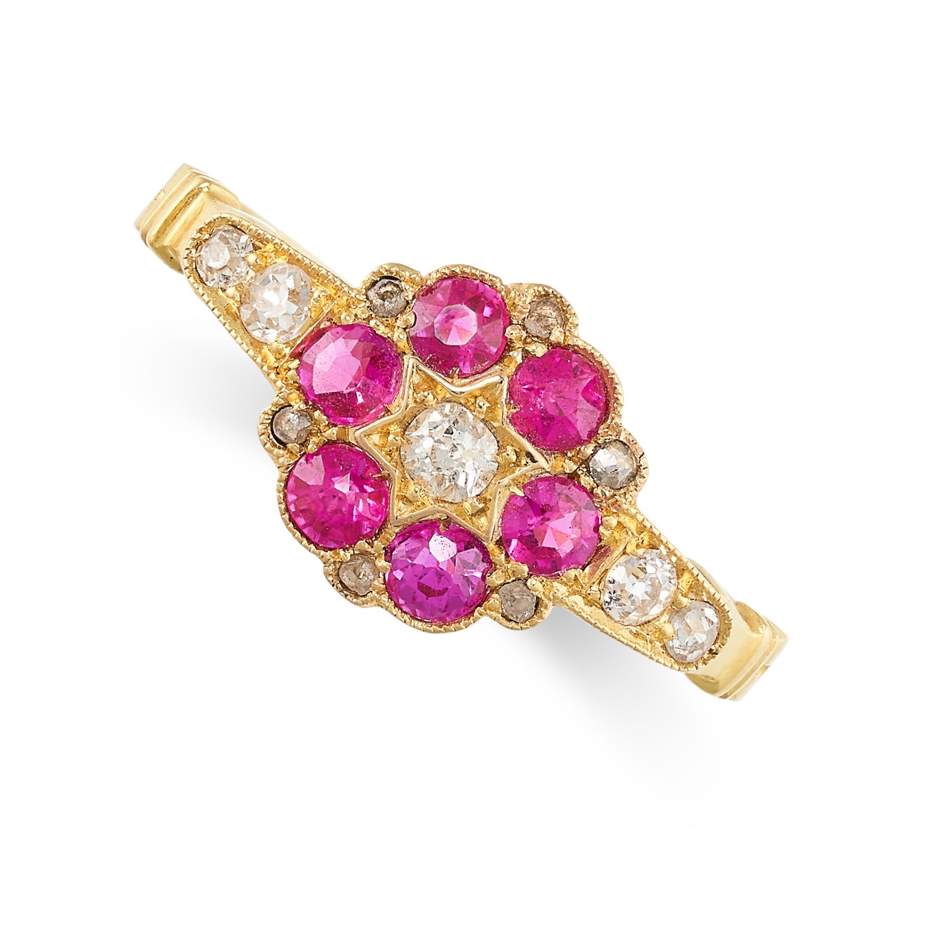 A RUBY AND DIAMOND DRESS RING in yellow gold, set with an old cut diamond within a border of round