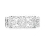 AN ART DECO DIAMOND PLAQUE BROOCH, CIRCA 1930 the stylised rectangular body of openwork design,