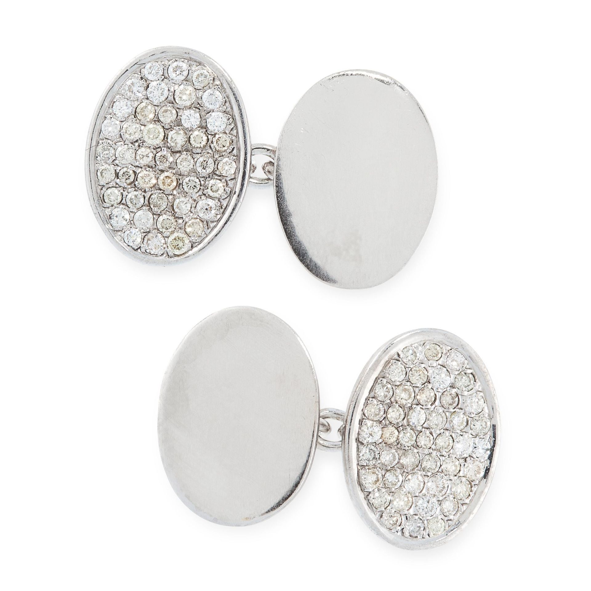 A PAIR OF DIAMOND CUFFLINKS in 18ct white gold, each comprising two oval faces, one face on each