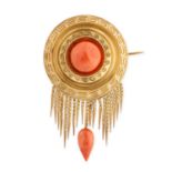 AN ANTIQUE CORAL TASSEL BROOCH, 19TH CENTURY in yellow gold, the circular body set to the centre