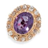 AN AMETHYST AND DIAMOND DRESS RING in yellow gold, set with an oval cut amethyst within a border