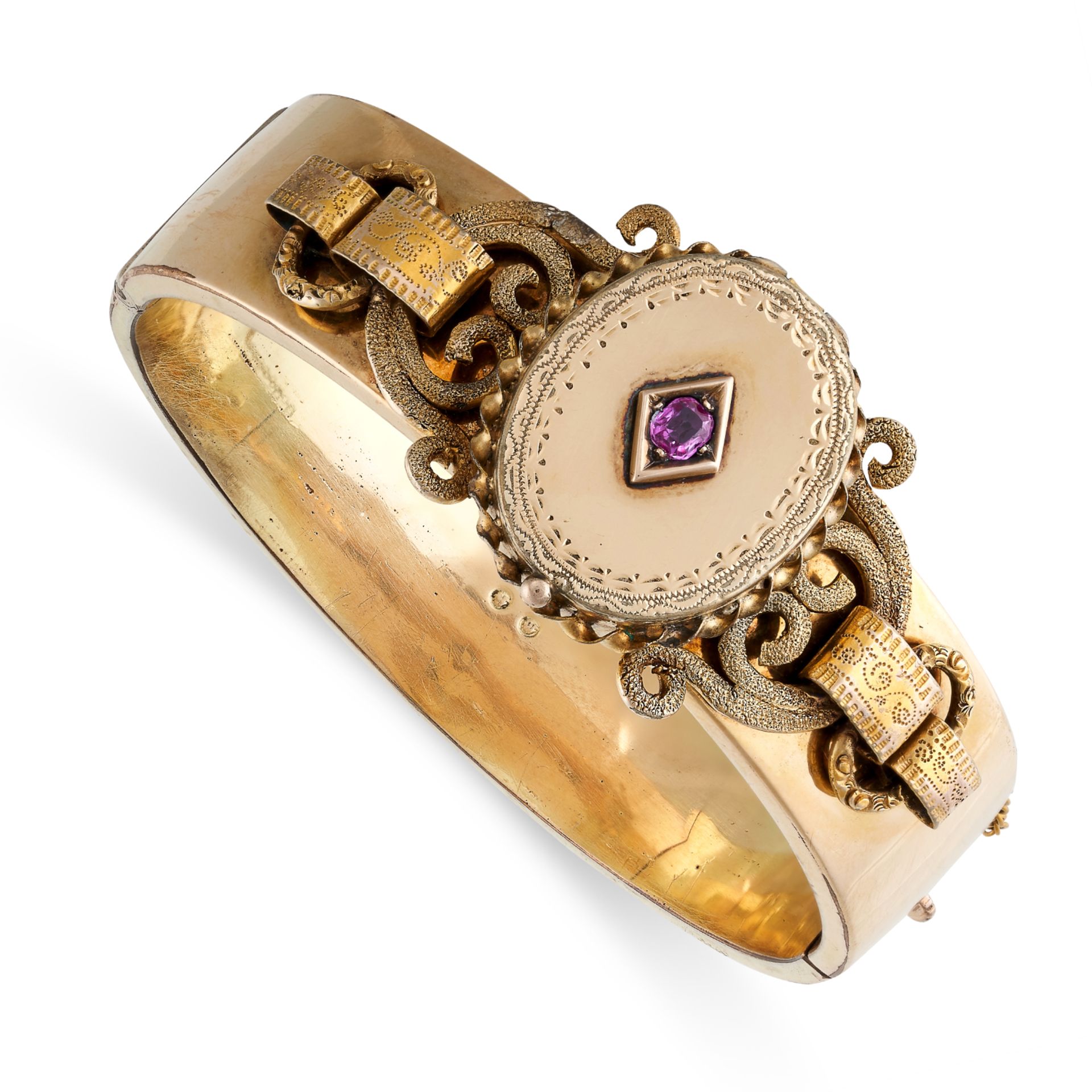AN ANTIQUE RUBY MOURNING LOCKET BANGLE in 14ct yellow gold, the hinged body with a concealed