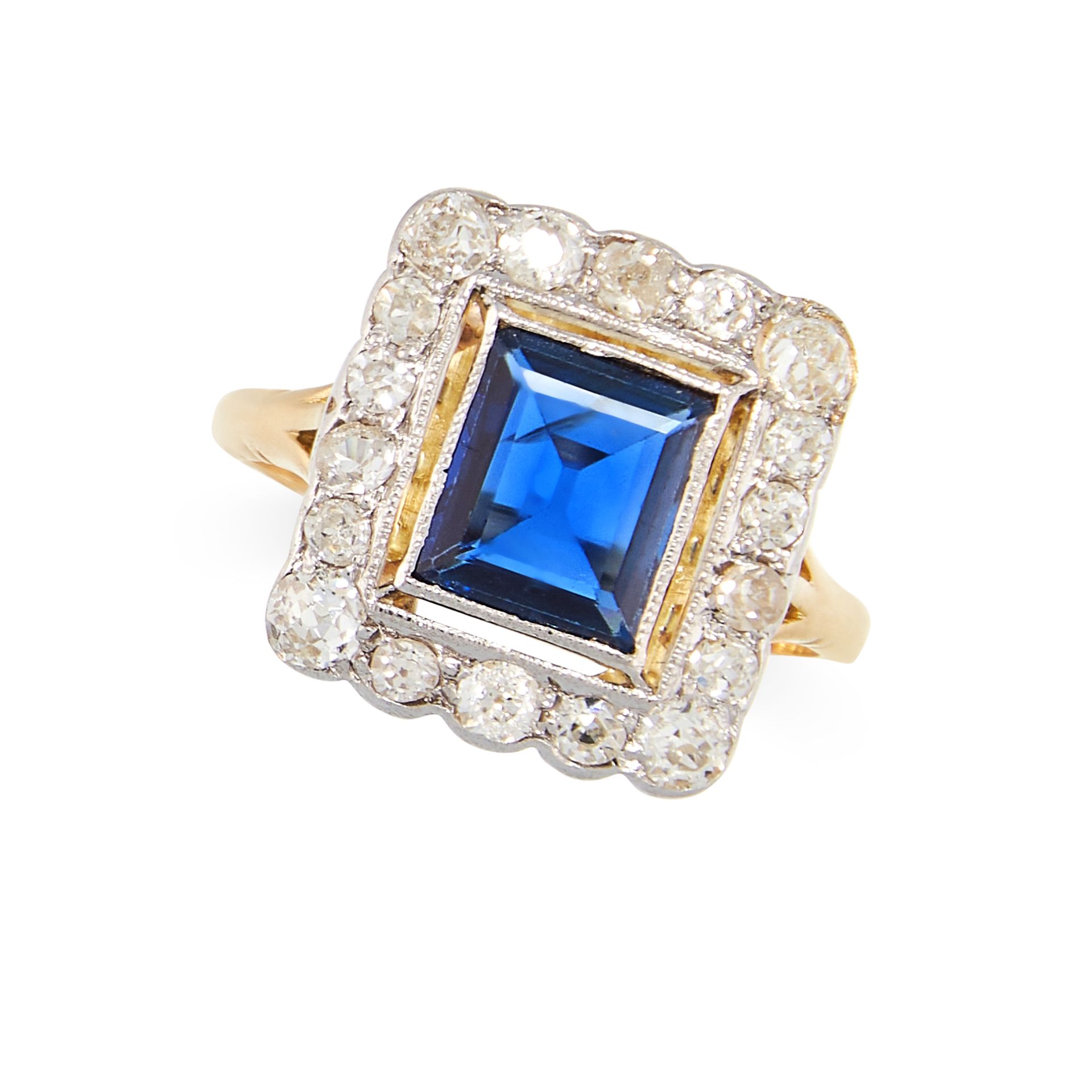 A SAPPHIRE AND DIAMOND RING set with a step cut sapphire of 1.24 carats within a cluster of old