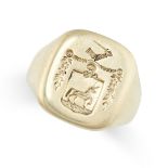 A SEAL / SIGNET RING in yellow gold, the cushion shaped face reverse engraved with a coat of arms