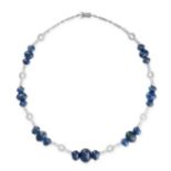 A SAPPHIRE AND DIAMOND NECKLACE in 18ct white gold, set with trios of graduated oval cabochon blue