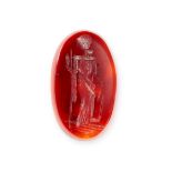 AN UNMOUNTED CARNELIAN INTAGLIO carved to depict a classical figure, 7.11 carats.