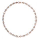 A FANCY COLOURED DIAMOND AND WHITE DIAMOND NECKLACE in 18ct yellow gold and white gold, formed of