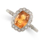 A YELLOW SAPPHIRE AND DIAMOND CLUSTER RING