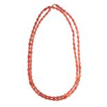 A CORAL AND SAPPHIRE BEAD SAUTOIR NECKLACE Polished coral beads  Faceted sapphire beads  Stamped 750