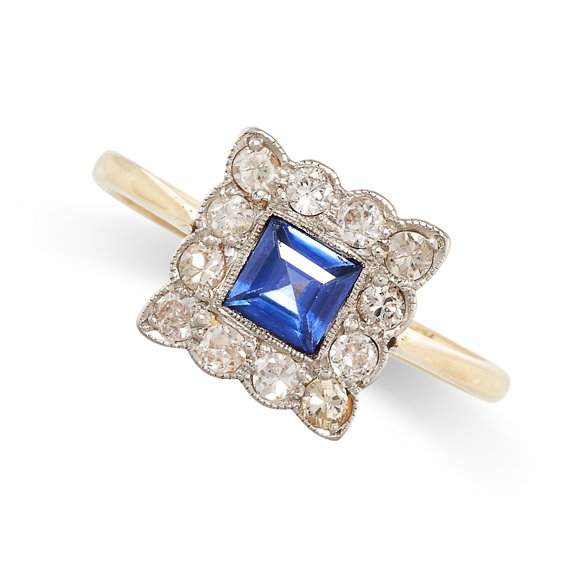 NO RESERVE - A SYNTHETIC SAPPHIRE AND DIAMOND CLUSTER RING  In 18 carat yellow gold and platinum