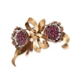 A RETRO RUBY AND DIAMOND FLOWER AND RIBBON BOW BROOCH, 1940S  Circular-cut rubies, approximate total