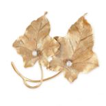 NO RESERVE - A VINTAGE DIAMOND LEAF BROOCH Made in 14 carat yellow gold, designed as two textured