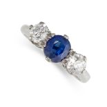 NO RESERVE - A SAPPHIRE AND DIAMOND THREE STONE RING  Cushion cut blue sapphire, weighing