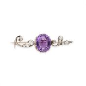NO RESERVE - AN AMETHYST AND DIAMOND BROOCH  Oval cut amethyst, weighing approximately 3.96
