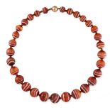 NO RESERVE - A BANDED CARNELIAN BEAD NECKLACE  Made in 9 carat yellow gold, bead shaped clasp