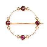 NO RESERVE - AN ANTIQUE GARNET AND PEARL BROOCH  Made in yellow gold, circular design  Circular