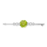 NO RESERVE - A PERIDOT AND DIAMOND BAR BROOCH, EARLY 20TH CENTURY  Made in 18 carat white gold and