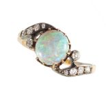 NO RESERVE - AN OPAL AND DIAMOND DRESS RING  Made in yellow gold and silver  Round cabochon opal